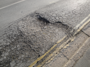 How to Spend a Fortune on Roads and Make Potholes Worse