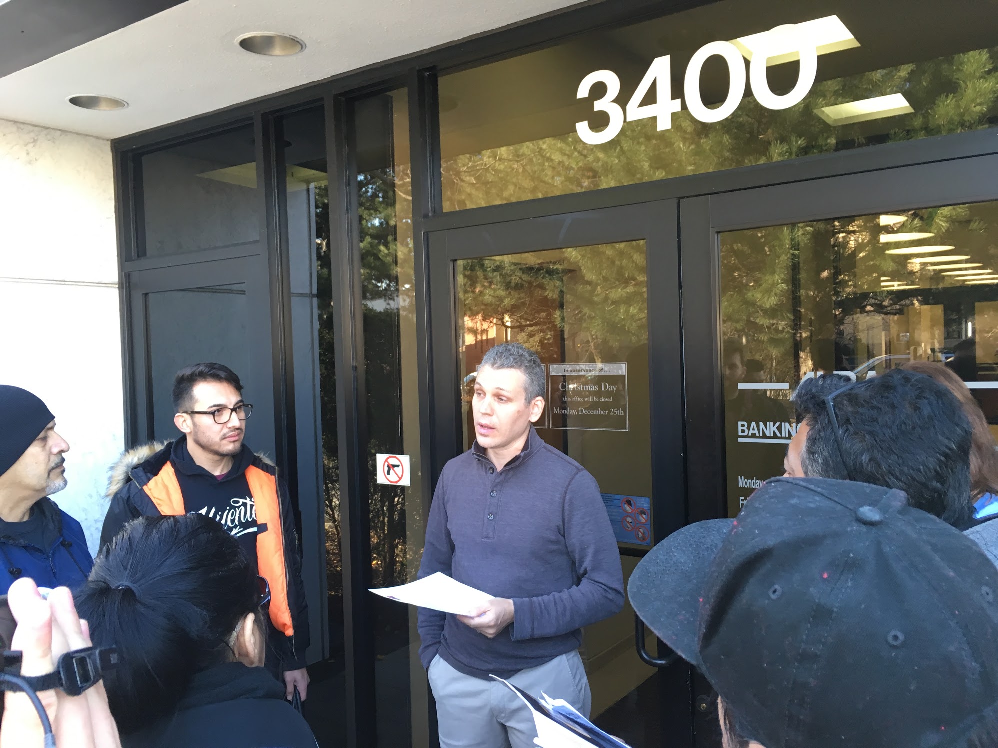 Adam Steinback from Albany Bank speaks with the activists. Photo: Lynda Lopez