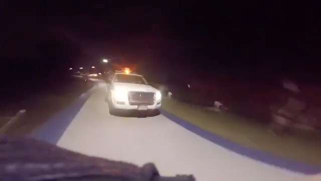 Chicago Park District SUV catching up to a bicyclist