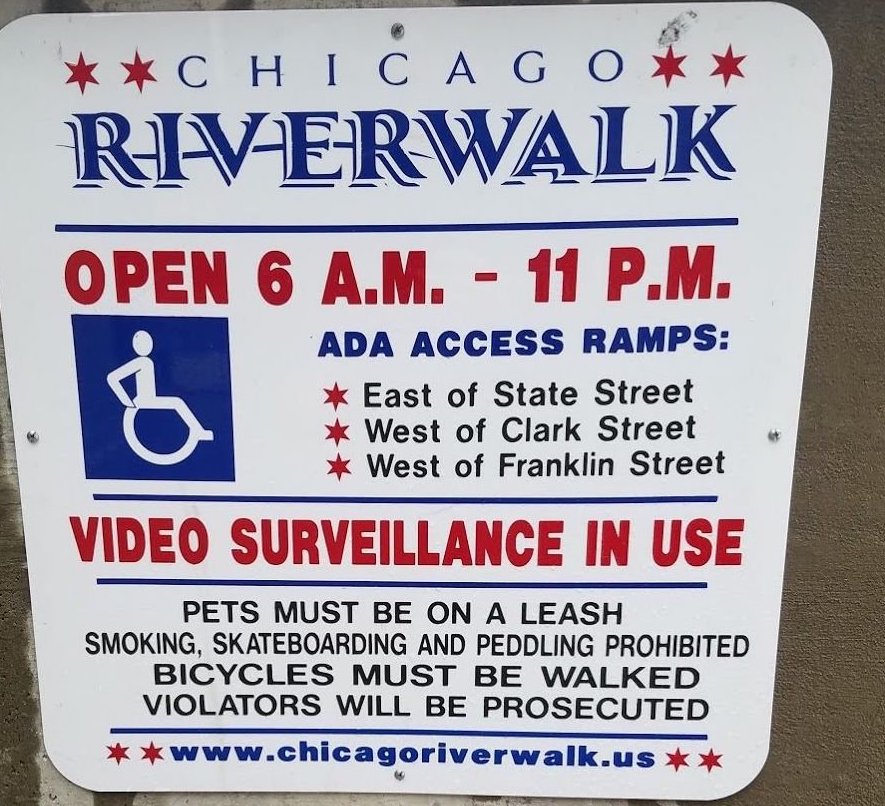 One of the signs at the riverwalk entrances making a bogus threat that bike riders will be prosecuted. Photo: John Greenfield