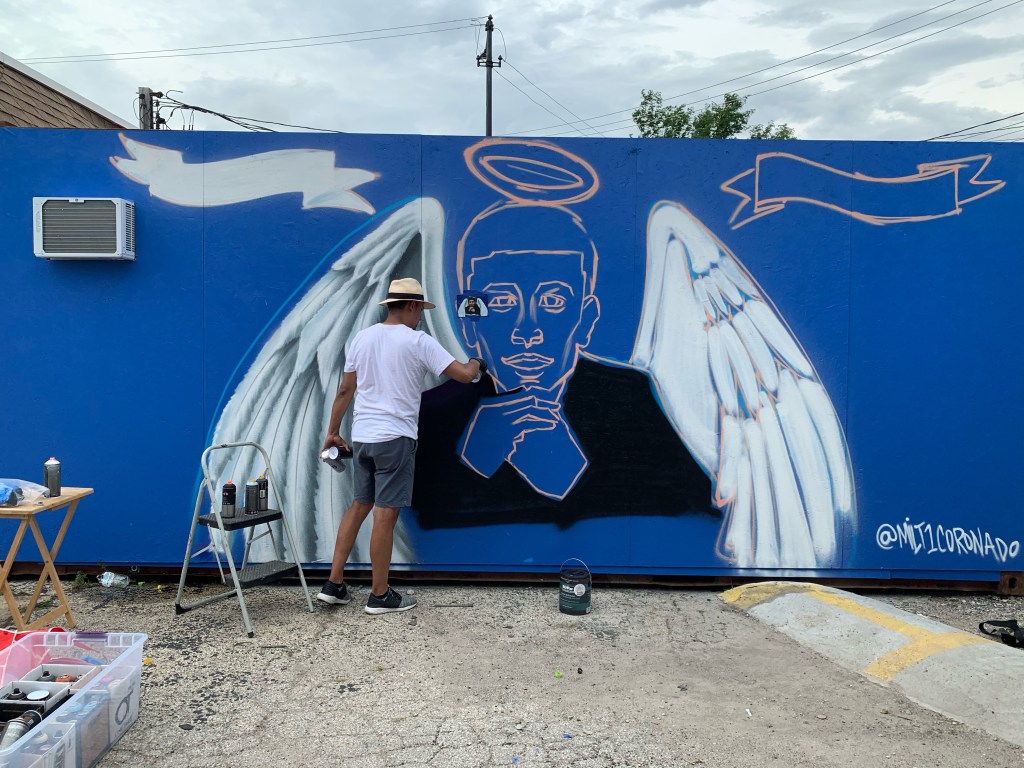 Family, friends, and cyclists gather once more to honor Issac Martinez at mural painting