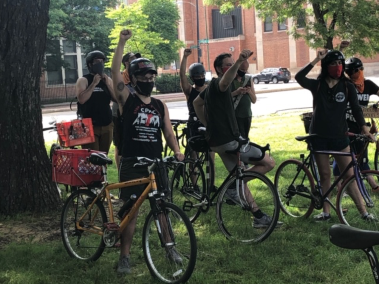 Giving the Black Power salute before the ride. Photo: Cameron Bolton