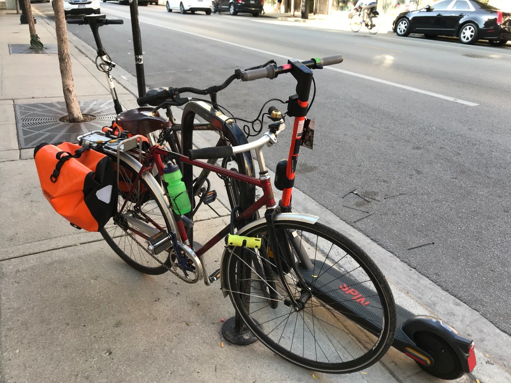 Chicago lock-to rule means scooters are parked on bike racks. Is that a problem or NBD?