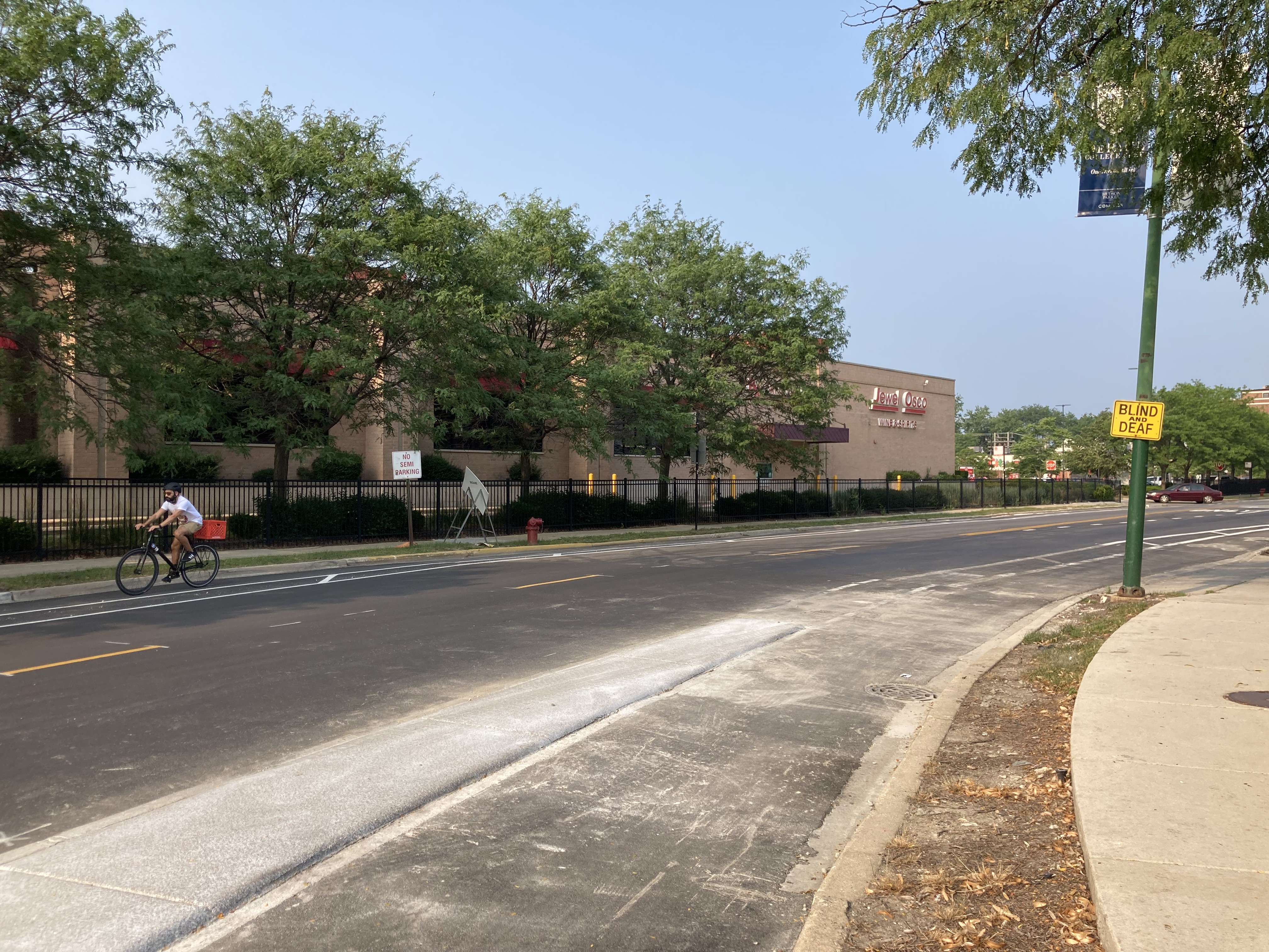The concrete protection disappears after Campbell curves east into Roscoe. Photo: John Greenfield