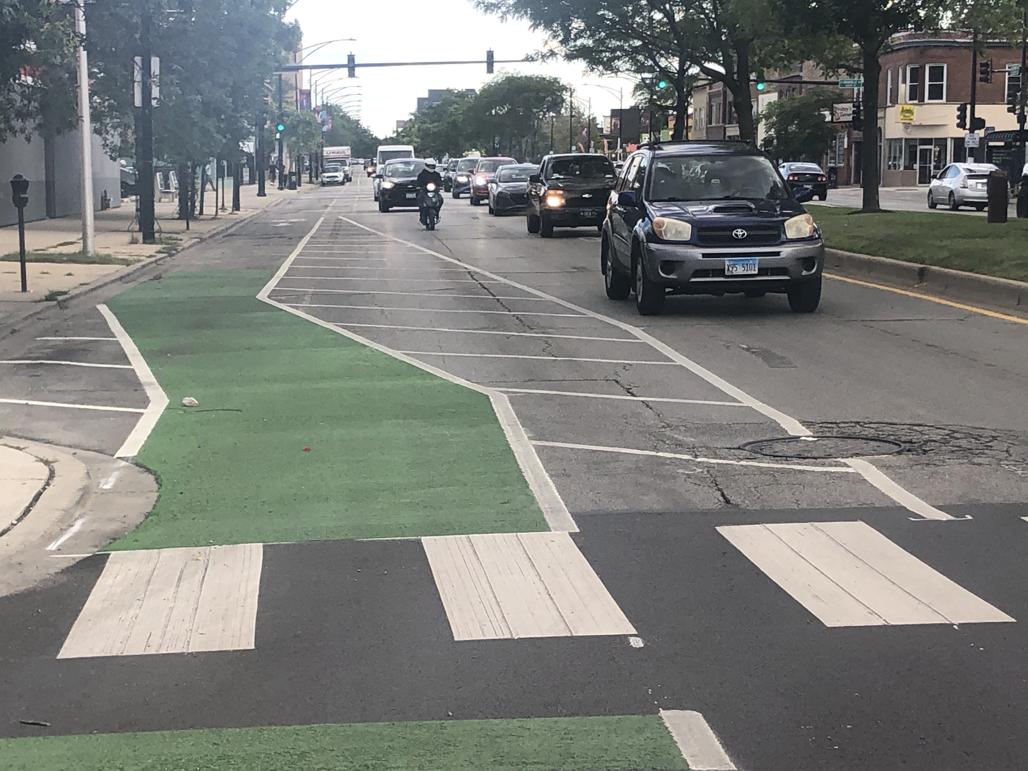 Looking South from a Northbound "bike lane" along Clark St. at near Granville. Driving lanes reduce from two to one with very little notice for drivers. A sign alerting drivers of a lane reduction would be helpful.