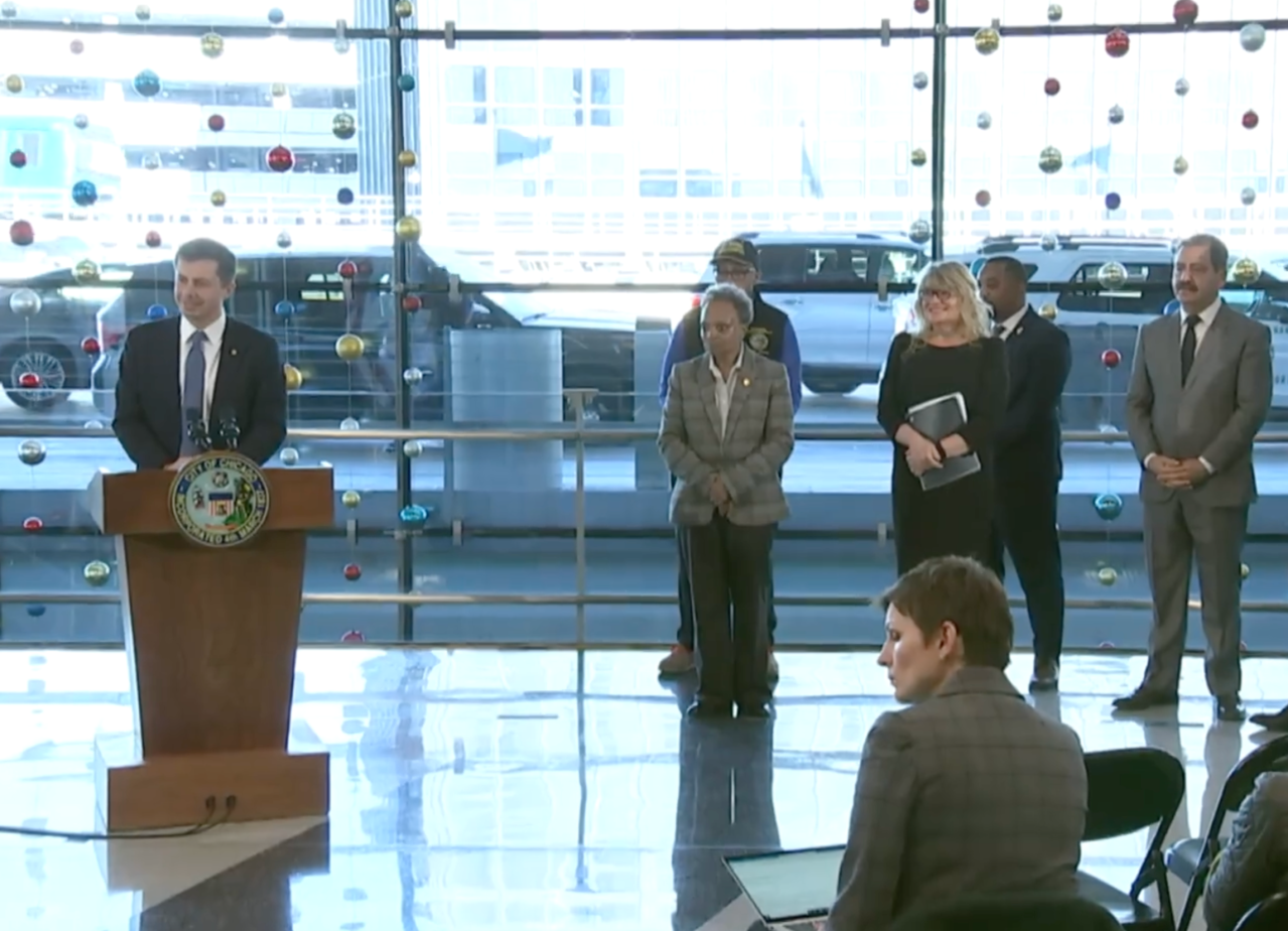 Buttigieg, Lightfoot, aviation chief Janet Rhee, and U.S. Congressional rep Chuy Garcia at today's press conference. Image: City of Chicago