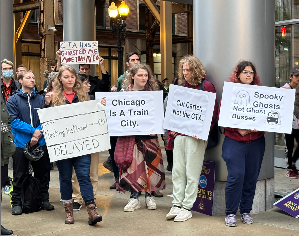 Dozens of advocates show up in the rain to call for overhauling the CTA at Cut Carter Protest